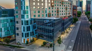 The Art Hotel Denver exterior with the Denver Art Museum in the background, Curio Collection by Hilton
