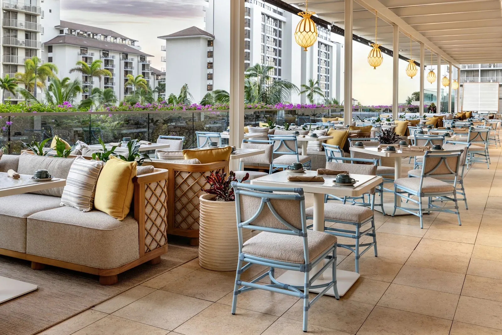 An outdoor restaurant terrace with tables at Ka La'i Waikiki Beach